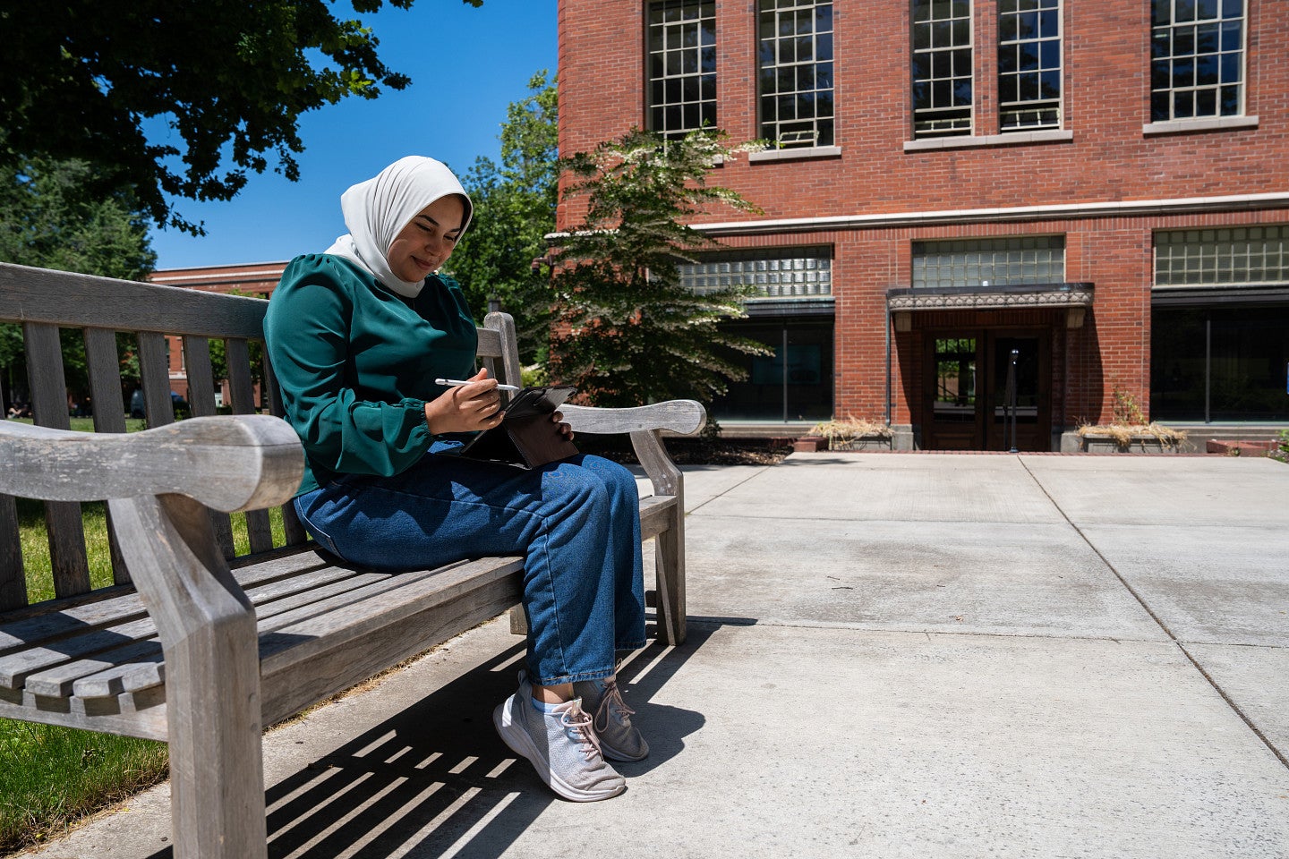 Female student sitting outside