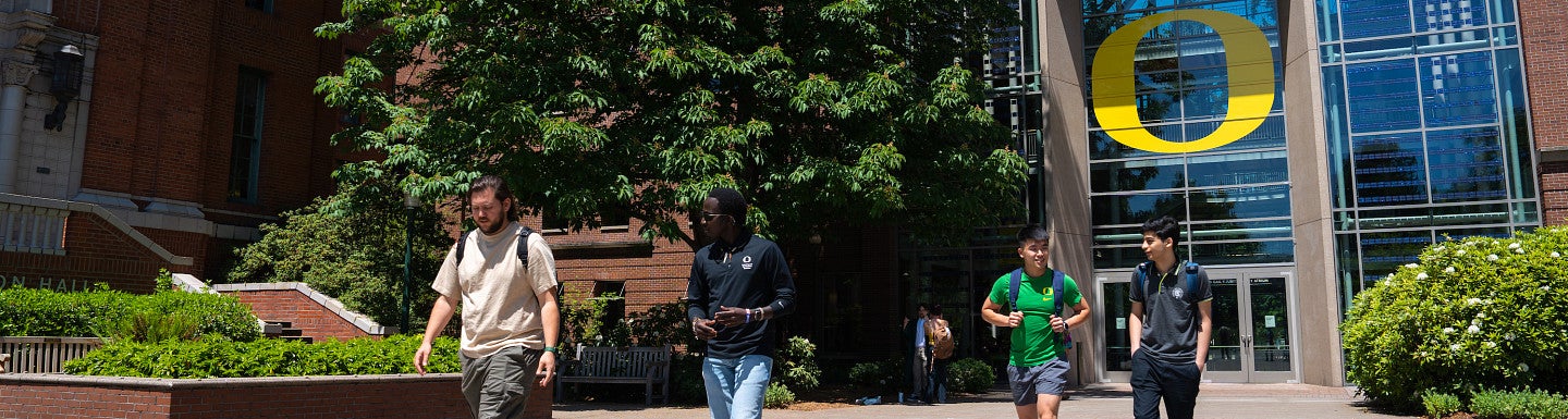Students walking in front of campus building