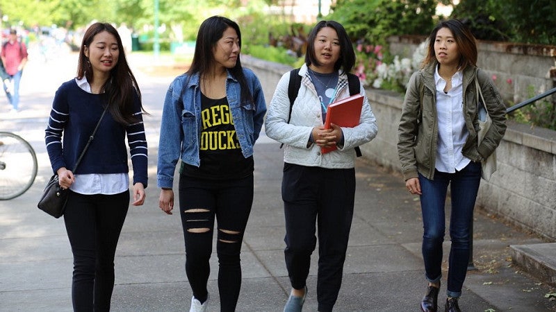 Female students walking on campus