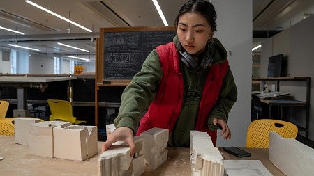 student works on architecture models