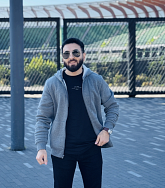 Hasan standing in front of Hayward Field