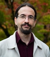 Head shot of Alper