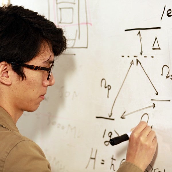 International Shuhao in front of a white board